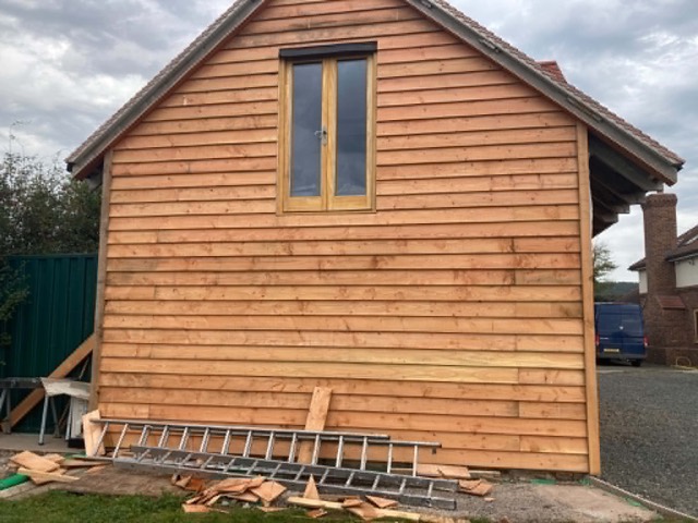 Timber cladding to a gable end